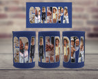 Three navy blue neoprene can coolers with the word 'GRANDPA' spelled out in large photo filled letters, shown on a wooden surface with a blurred brick wall background. A matching rectangular card is displayed above the can coolers.