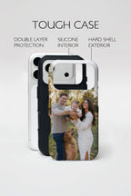 A phone case shown on a light gray background with feature callouts reading 'TOUGH CASE,' 'DOUBLE LAYER PROTECTION,' 'SILICONE INTERIOR,' and 'HARD SHELL EXTERIOR.' The case has an outer shell, black inner bumper, and a printed family photo on the back showing two adults, a child, and a dog.