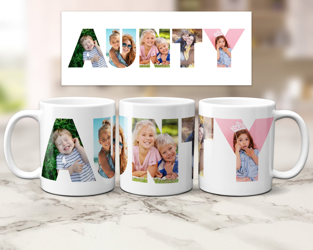 Three white ceramic mugs with custom photo filled letters spelling 'AUNTY' are displayed on a marble surface, with a matching letter print above them. The photos depict children in outdoor and indoor settings.