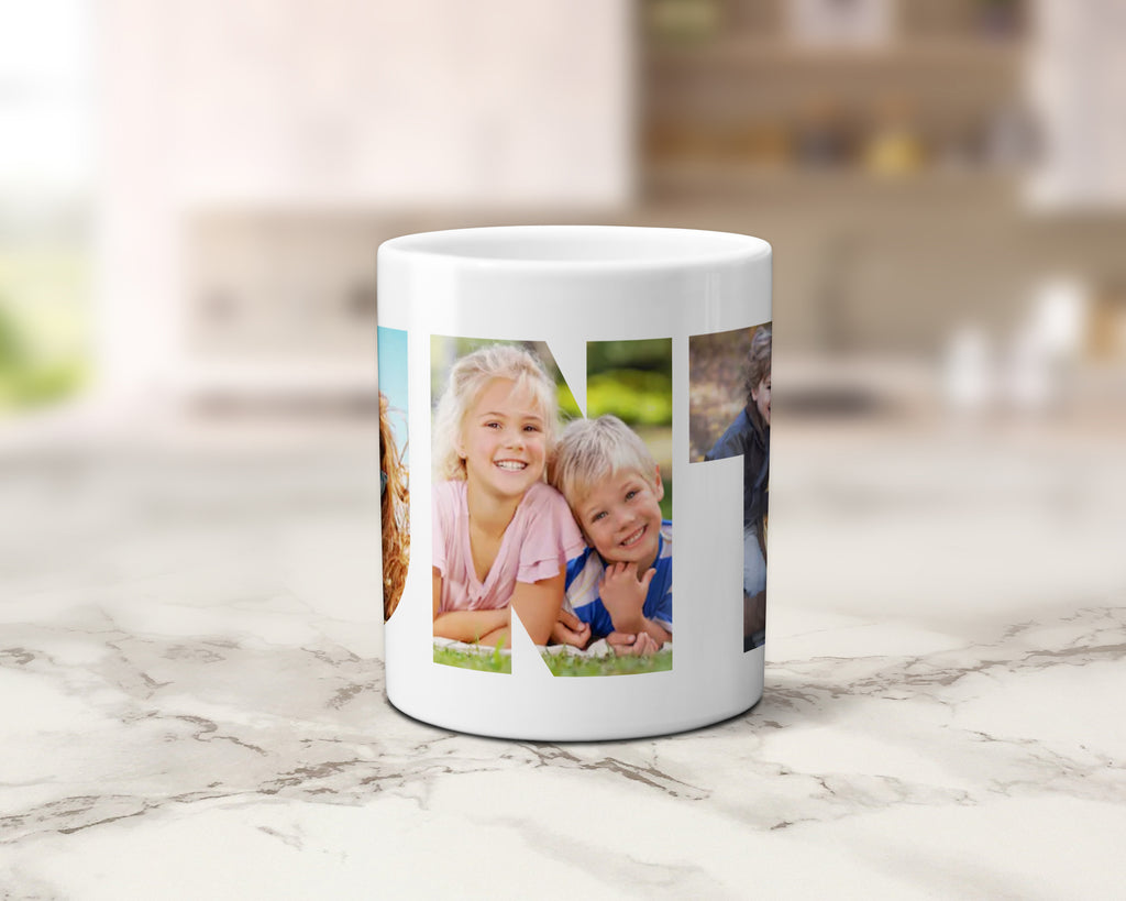 A white ceramic coffee mug with a custom photo collage print, displayed on a light marble countertop with a blurred kitchen background.
