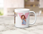 A white ceramic mug with a custom photo collage print featuring a pink letter 'Y' and a young girl, set on a light marble countertop with a blurred kitchen background.