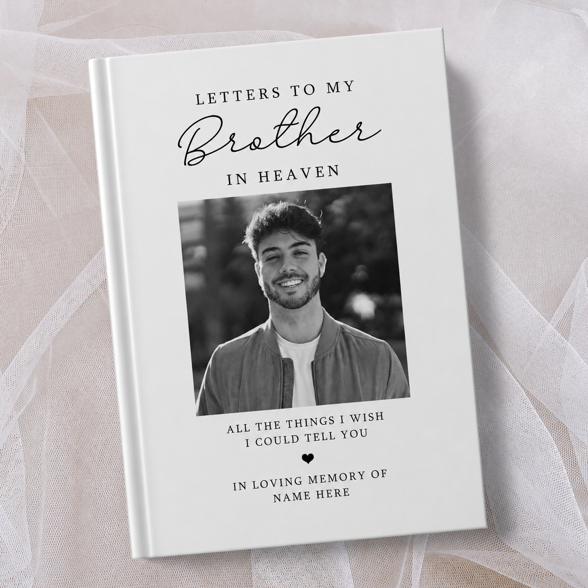 Personalised white hardcover memorial journal titled ‘Letters to My Brother in Heaven’, featuring a black and white photo of a smiling man on the cover with the words ‘All the things I wish I could tell you’ and ‘In loving memory’, personalised with a name