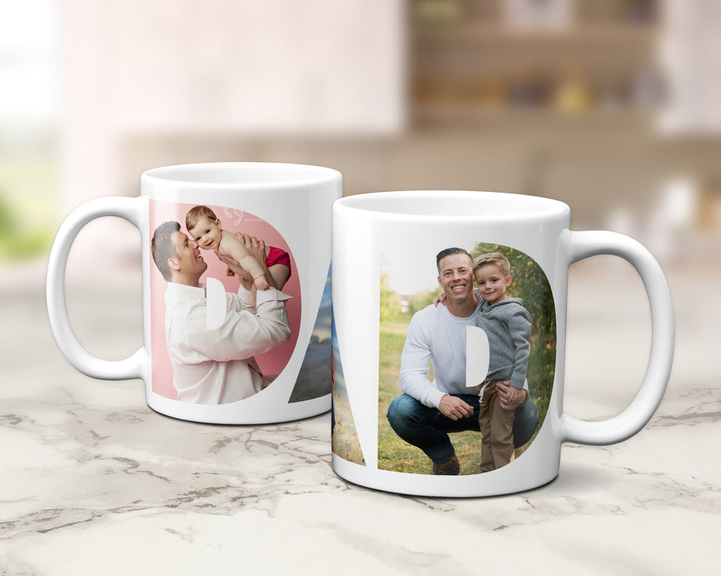 Two white ceramic mugs with custom printed family photos, displayed on a light marble countertop with a blurred kitchen background.