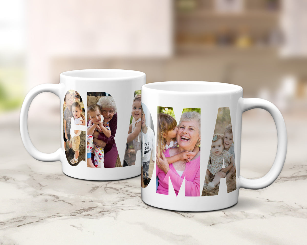 Two white ceramic mugs with photos displayed in large letters spelling 'GRANDMA' displayed on a light marble surface with a blurred kitchen background.