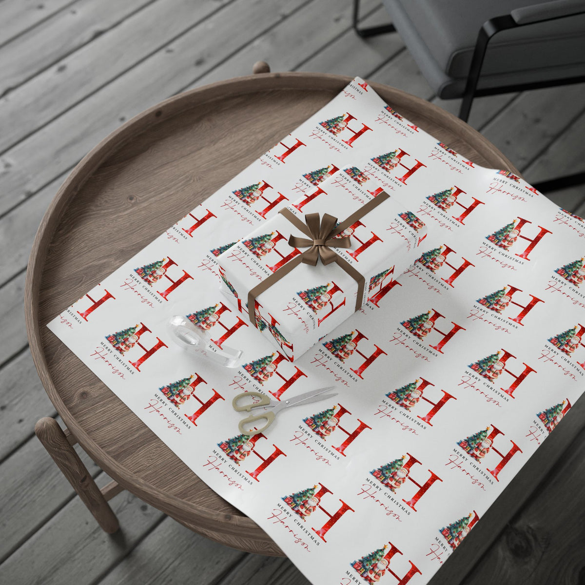 Gift box with a bow on a table covered with patterned paper