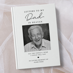 A hardcover book titled 'Letters to My Dad in Heaven' with a black and white portrait photo of an elderly man on the cover, styled on a white background with sheer white tulle.