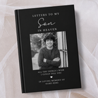 A black personalised hardcover book titled 'Letters to My Son in Heaven' with a placeholder photo of a young man, displayed on a soft beige fabric background.