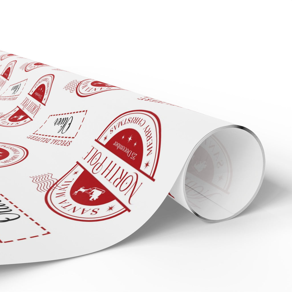 A roll of white wrapping paper printed with red holiday stamps and borders, shown on a clean white background.