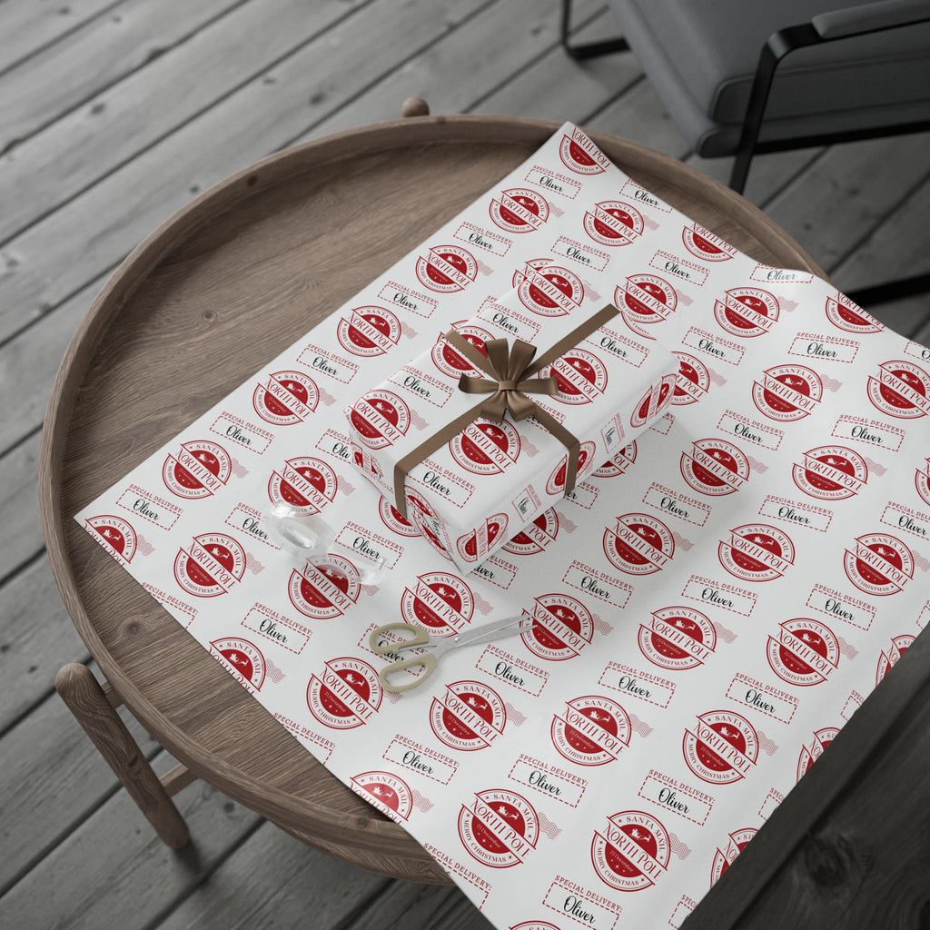 Gift box with a bow on a table covered with patterned paper