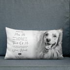 A rectangular pet memorial throw pillow featuring a black and white photo of a golden retriever and sentimental text, displayed on a blue fabric sofa.