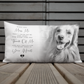 A rectangular personalised pet memorial pillow featuring a black and white photo of a Golden Retriever and sentimental text, displayed on a wooden surface against a grey panelled background.