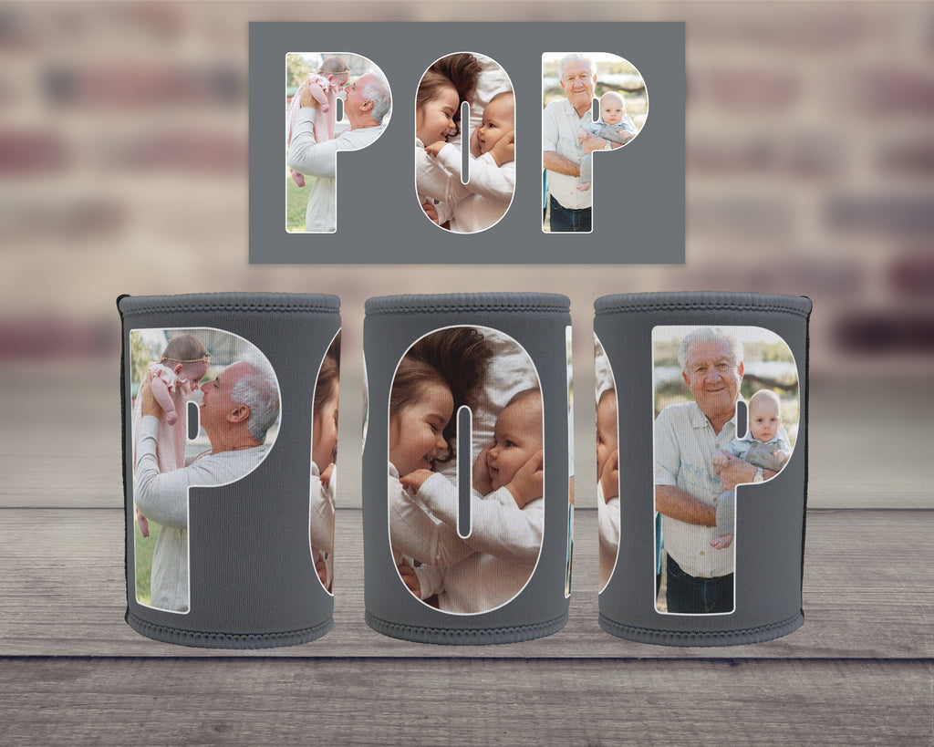Three grey can coolers arranged on a wooden surface, with a matching grey backdrop insert spelling POP above them. The can coolers have large text spelling POP with family photos within them.