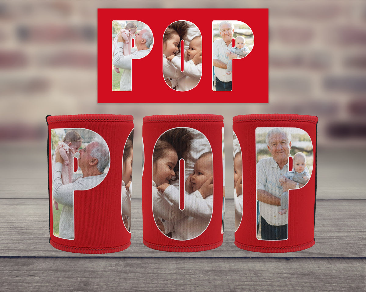 Three red can coolers with a matching red rectangular backdrop, each with large letters spelling 'POP', displaying family photos inside. The coolers are arranged on a grey wooden surface with a blurred brick wall background.