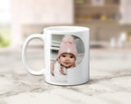 A ceramic mug with family photos within the letters spelling POP.