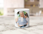 A ceramic mug with family photos within the letters spelling POP.