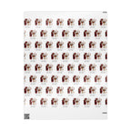 A sheet of wrapping paper with repeating illustrations featuring a vintage style portrait of Santa Claus and reindeer with the text 'Merry Christmas Matilda'.