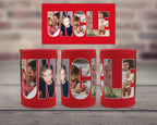 Three red can coolers displayed on a wooden surface with a blurred brick wall background. Above them is a matching red rectangular print featuring the word 'UNCLE' filled with family photos.