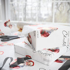 Personalised Christmas wrapping paper featuring a classic watercolour Santa Claus design, beautifully wrapped around gifts with ribbon and scissors nearby.