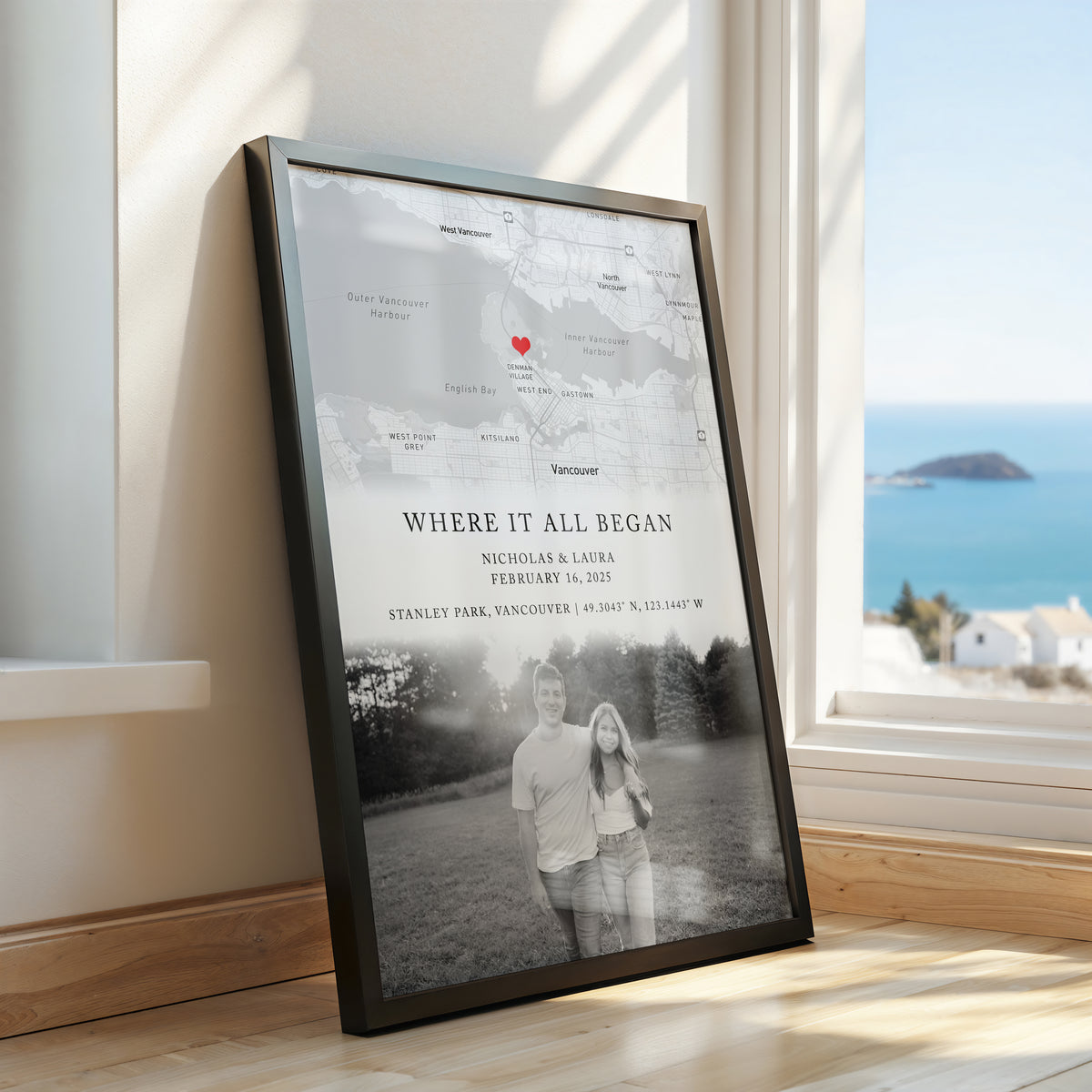 Personalised “Where It All Began” map print featuring a couple’s names, date, location, coordinates, heart marker and black-and-white photo, displayed in a black frame.